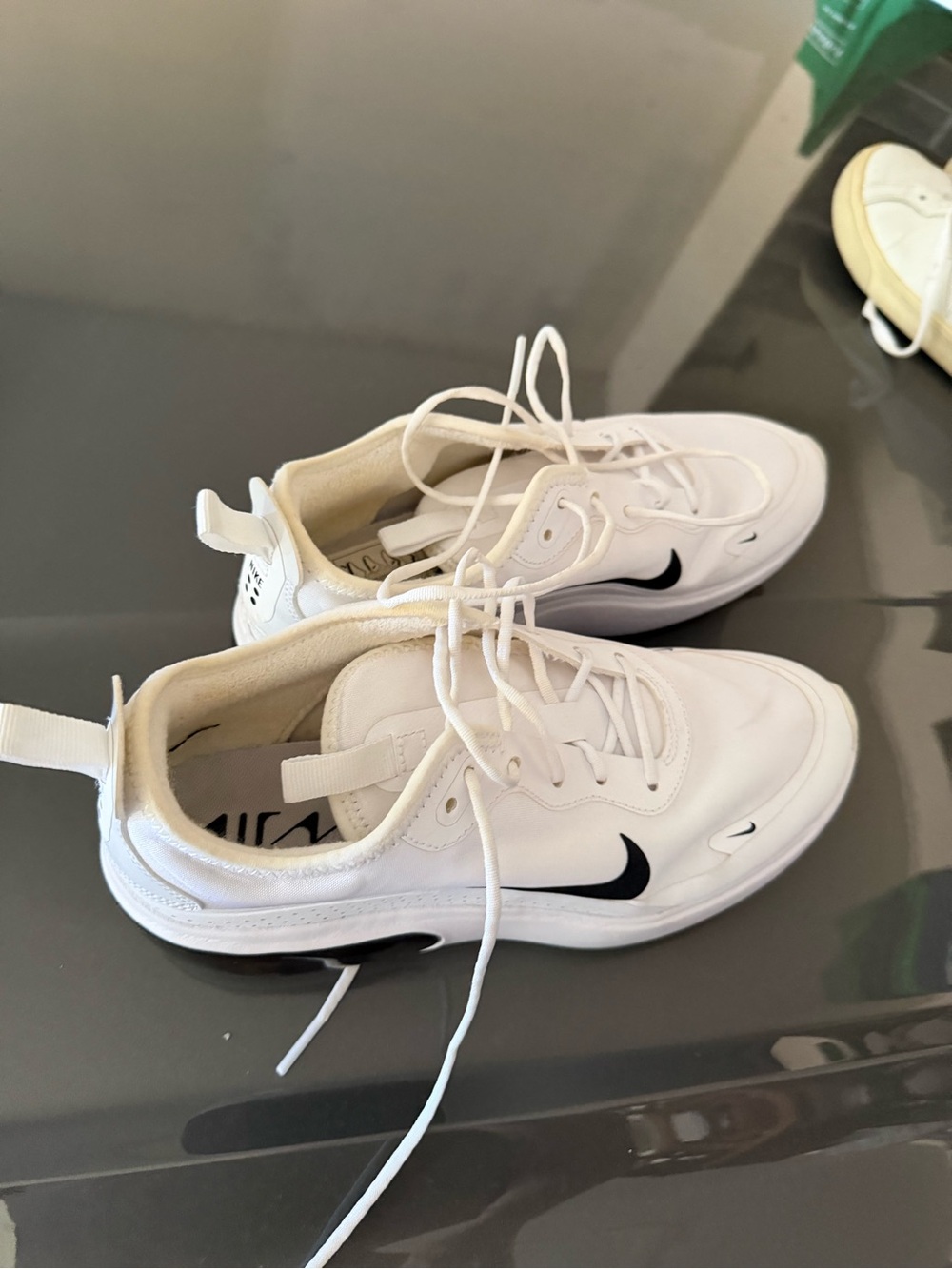 Nike Women’s White Sneakers with Black Swoosh Accent